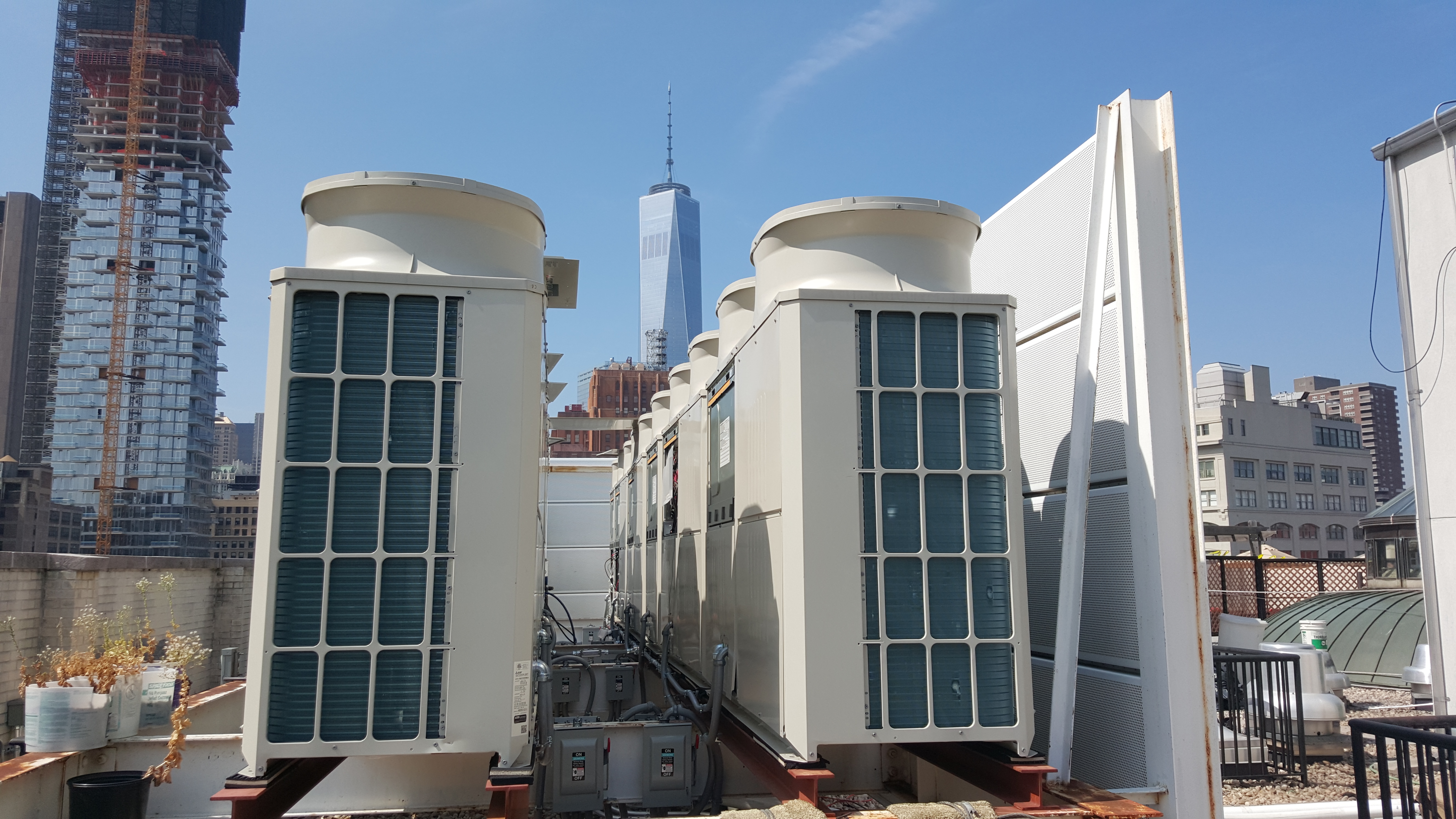 Mitsubishi City-Multi heat pumps on the roof of 260 West Broadway with the Freedom Tower in the background