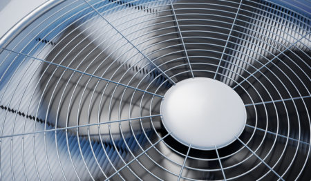 An HVAC fan functioning properly in an outside AC unit